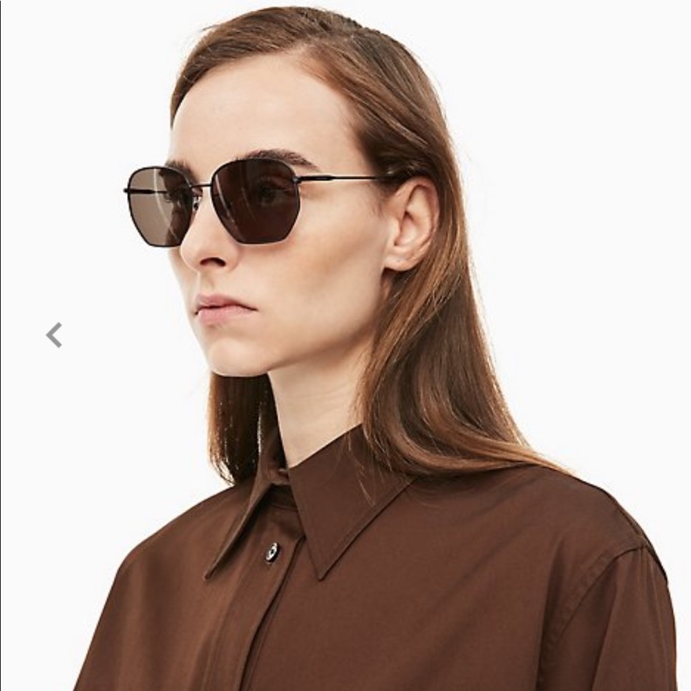 Calvin Klein unisex black matte rectangular sunglasses.